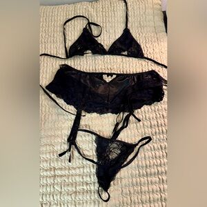 Adore Me lingerie set with bra, garter, & thong. Size XS. Black lace.